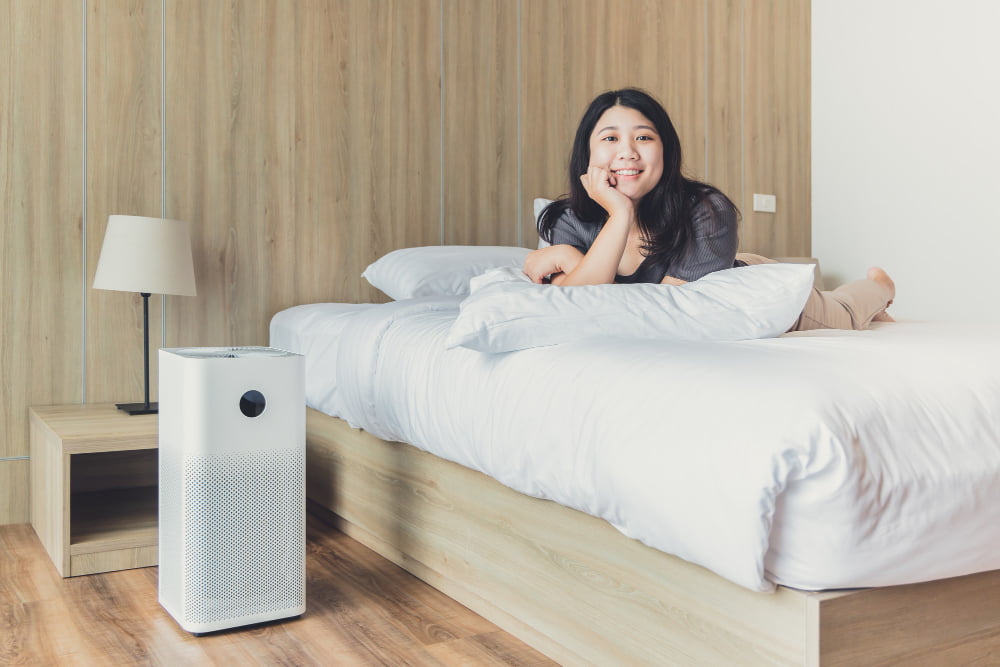 air purifier in bed